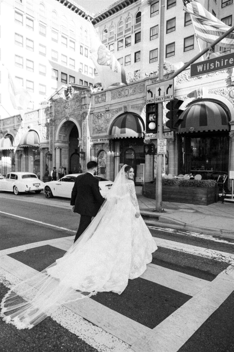 bride and groom crossing the street in Beverly Hills