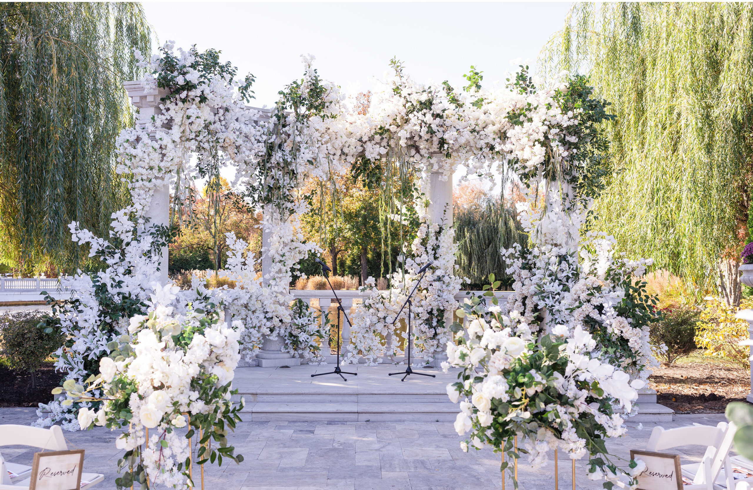 outdoor wedding ceremony decor with white florals