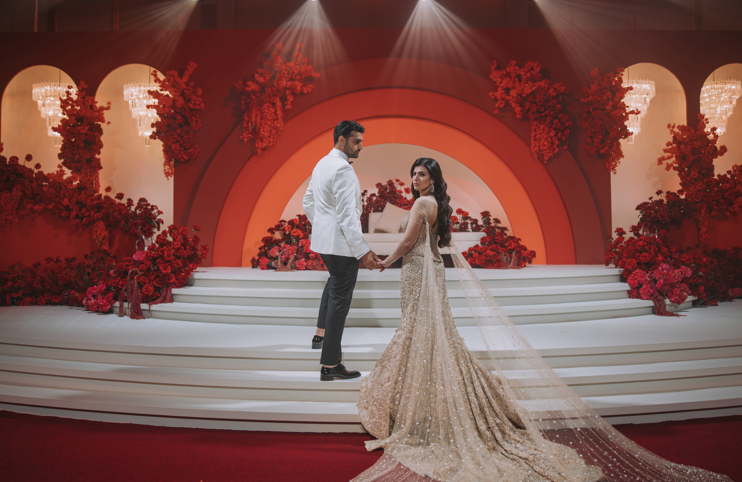 bride and groom in an all-red wedding reception in Dubai