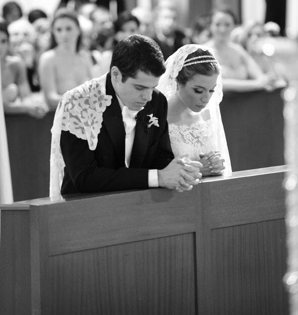 Bride & Groom Kneeling at Altar