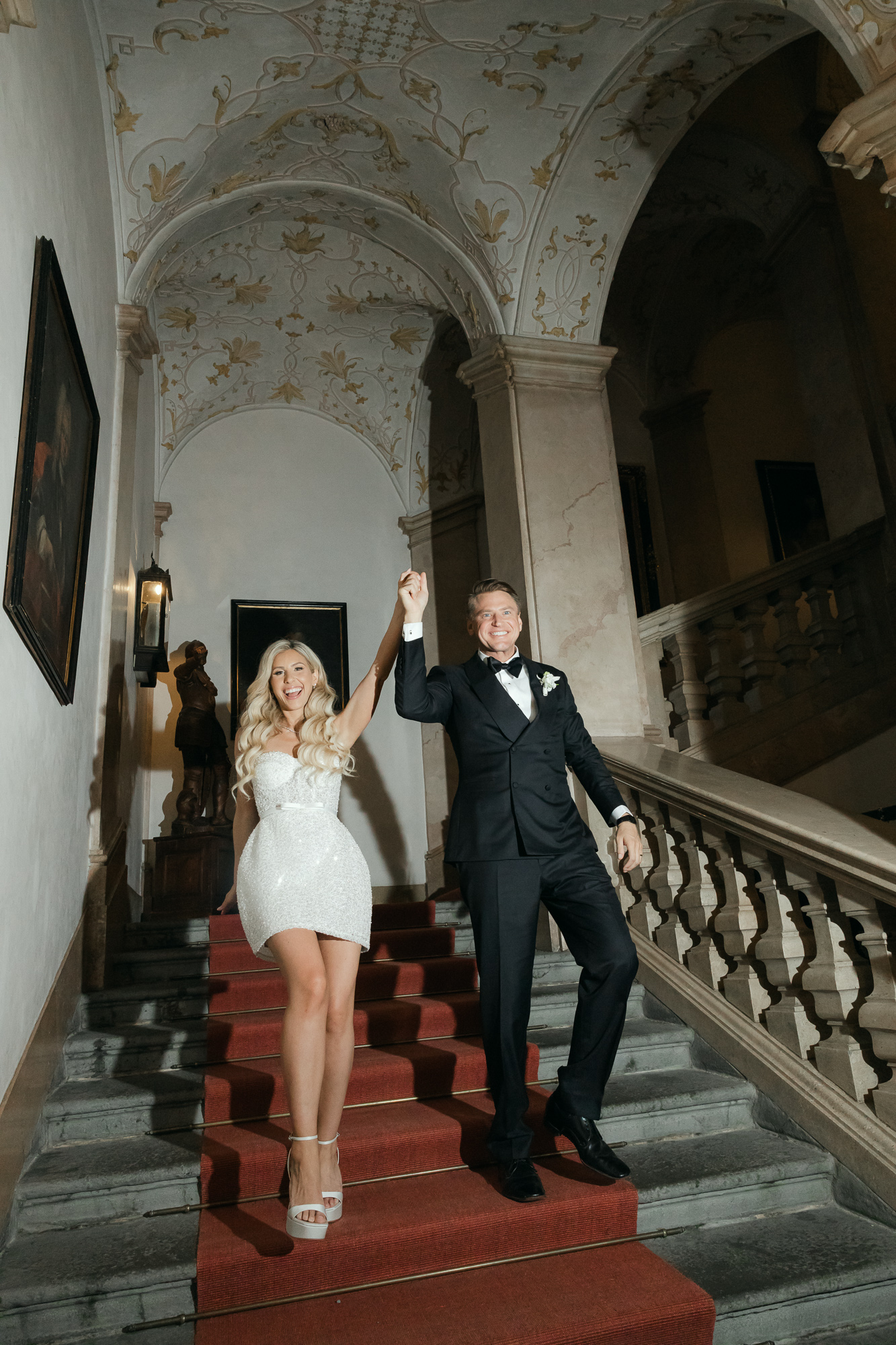 schloss-leopoldskron-wedding-salzburg-134 bride and groom walking down stairs at Schloss Leopoldskron