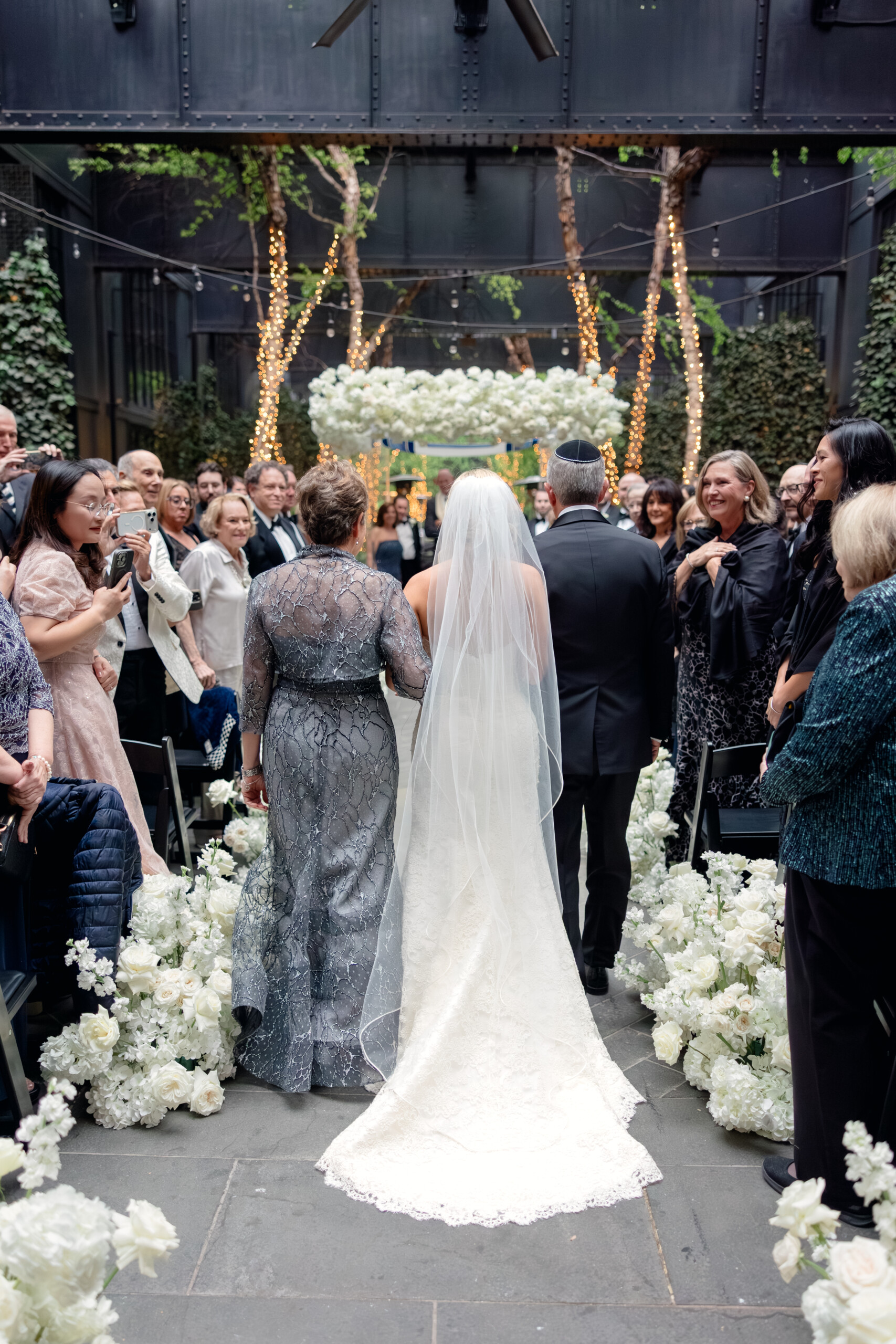 0G4A3978 bride walking down aisle with parents